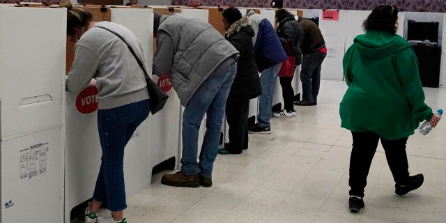 Voters fill out their ballots once inside the polling place at the Oklahoma County Election Board, Thursday, Oct. 29, 2020, in Oklahoma City.