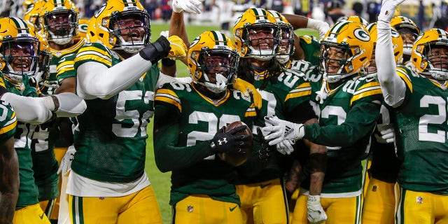 Green Bay Packers' Darnell Savage (26) celebrates his interception with teammates during the first half of an NFL football game Sunday, Nov. 29, 2020, in Green Bay, Wis. (AP Photo/Matt Ludtke)