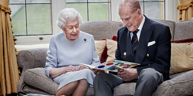 Prince Harry said his grandparents Queen Elizabeth II and Prince Philip (pictured here) weren't the ones who questioned him about Archie's skin tone.