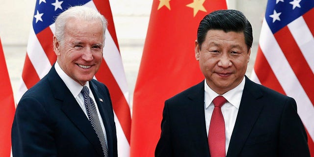 FILE - Chinese President Xi Jinping shakes hands with U.S. Vice President Biden inside the Great Hall of the People in Beijing December 4, 2013. REUTERS/Lintao Zhang/Pool