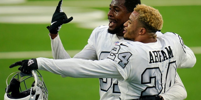 Las Vegas Raiders cornerback Isaiah Johnson, sinistra, and strong safety Johnathan Abram (24) celebrate after the Raiders defeated the Los Angeles Chargers in an NFL football game Sunday, Nov. 8, 2020, in Inglewood, Calif. (AP Photo/Alex Gallardo)