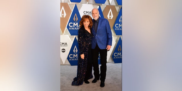 Reba McEntire and Rex Linn made their red carpet debut at the 54th Annual CMA Awards. (ABC via Getty Images)REBA MCENTIRE, REX LINN