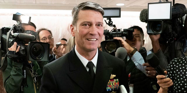 FILE - In this April 24, 2018 file photo, Ronny Jackson leaves a Senate office building on Capitol Hill in Washington. Jackson, President Donald Trump's former White House physician and onetime pick to head the Department of Veterans Affairs, is running for a congressional seat out of Texas. (AP Photo/J. Scott Applewhite, File)