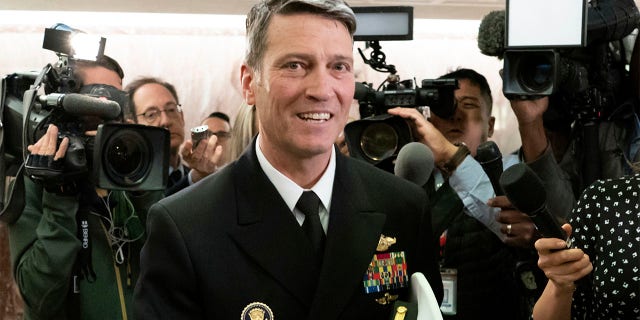 FILE - In this April 24, 2018 file photo, Ronny Jackson leaves a Senate office building on Capitol Hill in Washington. Jackson, President Donald Trump's former White House physician and onetime pick to head the Department of Veterans Affairs, is running for a congressional seat out of Texas. (AP Photo/J. Scott Applewhite, File)