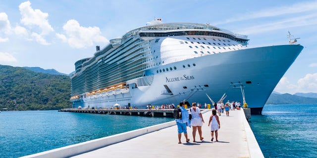 Guests embark Royal Caribbean's Allure of the Seas ship in this 2012 foto.