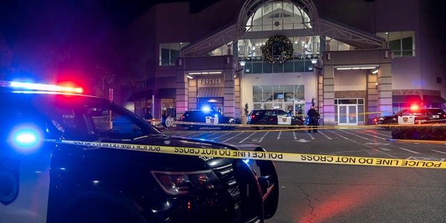 Sacramento police work at the area where one person was killed and another critically wounded in a shooting at Arden Fair Mall in Sacramento, Calif., Friday, Nov 27, 2020. The mall was evacuated in the midst of Black Friday, one of the busiest shopping days. Police later said the suspect had fled and there was no active threat to the mall. (Paul Kitagaki Jr./The Sacramento Bee via AP)