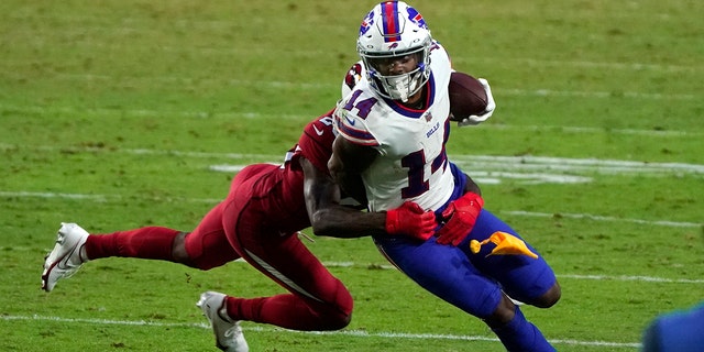 FILE- In this Sunday, Nov. 15, 2020, file photo, Buffalo Bills wide receiver Stefon Diggs (14) tries to turn upfield after a reception during an NFL football game against the Arizona Cardinals, in Glendale, Ariz. (AP Photo/Rick Scuteri, File)
