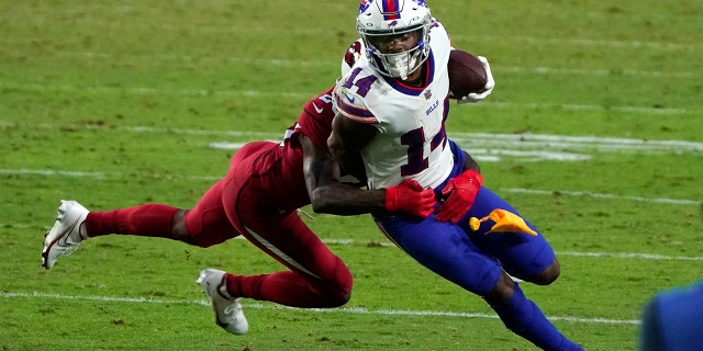 FILE- In this Sunday, Nov. 15, 2020, file photo, Buffalo Bills wide receiver Stefon Diggs (14) tries to turn upfield after a reception during an NFL football game against the Arizona Cardinals, in Glendale, Ariz. (AP Photo/Rick Scuteri, File)