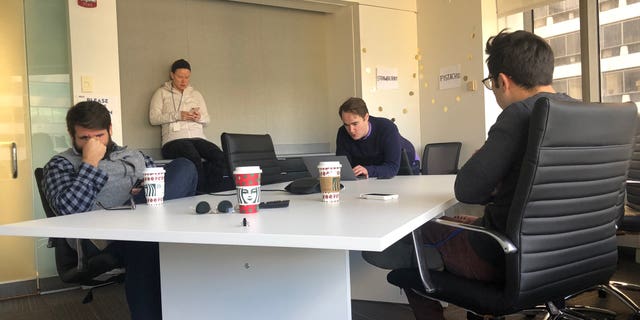 Bates, center, in the 'Pistachio' 'Strawberry' conference room at the Biden Headquarters, with Bill Russo, left, Kate Bedingfield, and to the right, TJ Ducklo.