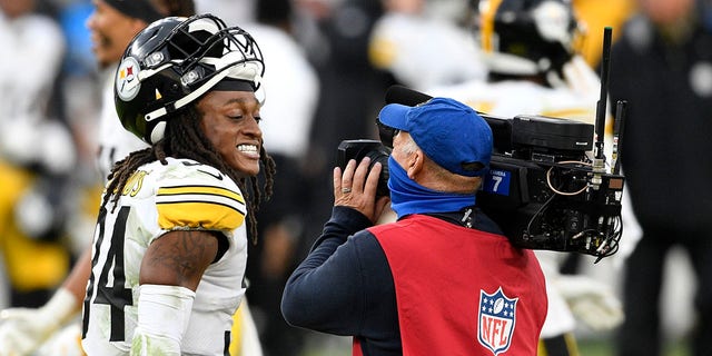 Pittsburgh Steelers strong safety Terrell Edmunds (34) smiles for a television camera after an NFL football game against the Baltimore Ravens, Sunday, Nov. 1, 2020, in Baltimore. The Steelers won 28-24. (AP Photo/Nick Wass)