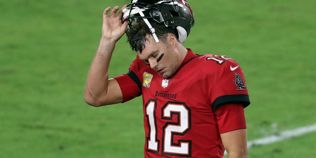 Tampa Bay Buccaneers quarterback Tom Brady (12) reacts as he leaves the field after throwing an interception against the New Orleans Saints during the second half of an NFL football game Sunday, Nov. 8, 2020, in Tampa, Fla. (AP Photo/Mark LoMoglio)