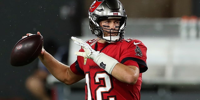 Tampa Bay Buccaneers quarterback Tom Brady (12) throws a pass before an NFL football game against the New Orleans Saints Sunday, Nov. 8, 2020, in Tampa, Fla. (AP Photo/Mark LoMoglio)