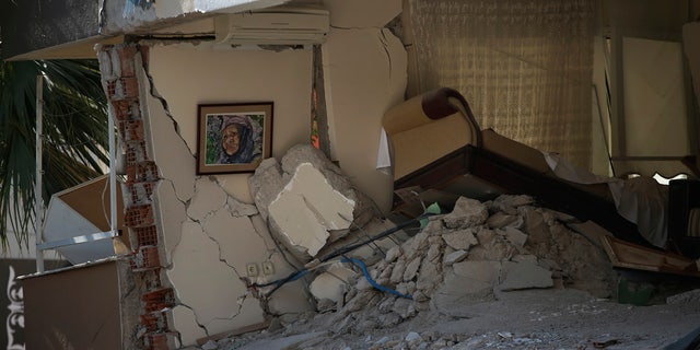 The interior of a destroyed living room of a family flat is seen after the building collapsed in Izmir, Turkey, Sunday, Nov. 1, 2020.