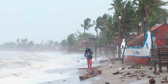 Strong waves batter the coast of Sorsogon province, central Philippines as a typhoon locally known as Goni hits the country on Sunday, Nov. 1, 2020. (Associated Press)