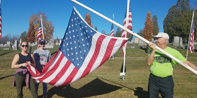 Volunteers setting up the flag display at Blairsville Cemetery, Blairsville, Penn. (Photo by Judy McAtee)