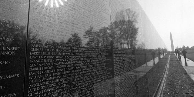 The morning sun reflects from the black marble walls of the Vietnam Veterans Memorial in Washington on Nov. 9, 1982. The memorial contains the names of more than 50,000 Americans killed or missing in the Vietnam conflict. (AP Photo/Bob Daugherty)