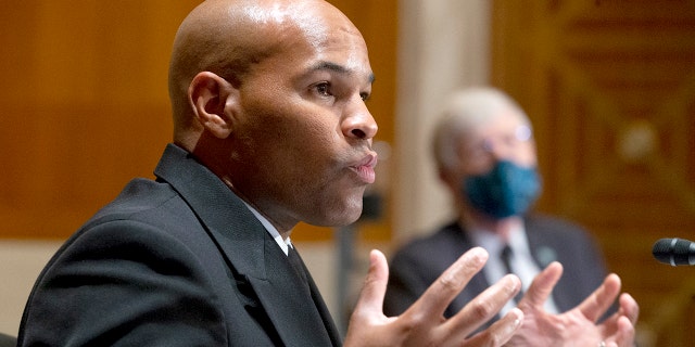 WASHINGTON - SEPTEMBER 9: U.S. Surgeon General Jerome Adams (left) and National Institutes of Health Director Dr. Francis Collins (right) appear before a Senate Committee hearing on Health, Education, Labor and pensions to discuss vaccines and public health protection during the coronavirus pandemic on September 9, 2020 in Washington DC.  (Photo by Michael Reynolds - Pool / Getty Images)