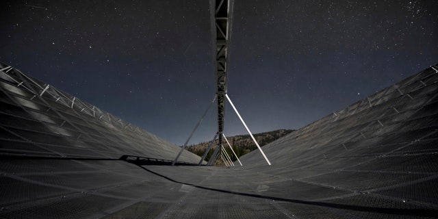 This November 2016 photo provided by the Canadian Hydrogen Intensity Mapping Experiment collaboration shows the CHIME radio telescope at the Dominion Radio Astrophysical Observatory in Kaleden, British Columbia, Canada.
