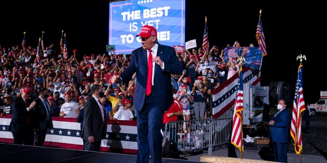 President Donald Trump dances as he walks off stage after speaking during a campaign rally at Miami-Opa-locka Executive Airport, Monday, Nov. 2, 2020, in Opa-locka, Fla. (AP Photo/Evan Vucci)