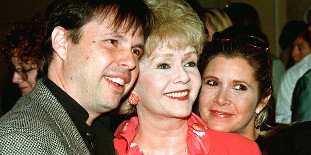 Debbie Reynolds (C), with son Todd Fisher and daughter Carrie Fisher.