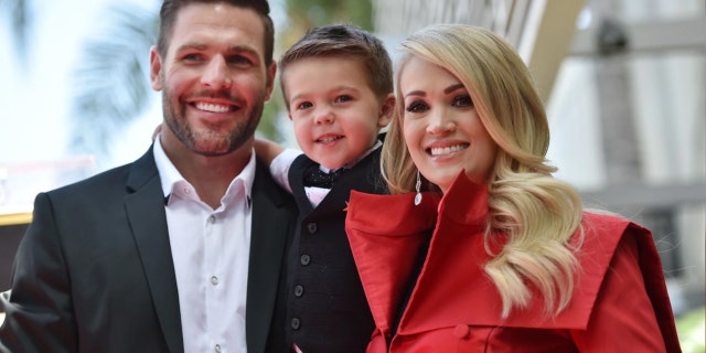 Carrie Underwood, husband Mike Fisher and son Isaiah at the Underwood Star Unveiling Ceremony on the Hollywood Walk of Fame on September 20, 2018.