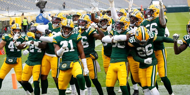The Green Bay Packers defense celebrates after an interception and touchdown return during the first half of an NFL football game against the Jacksonville Jaguars Sunday, Nov. 15, 2020, in Green Bay, Wis. (AP Photo/Matt Ludtke)