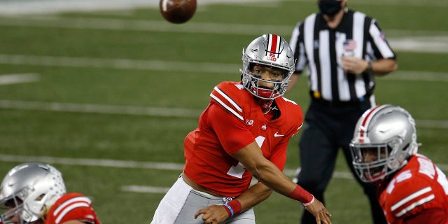 Ohio State quarterback Justin Fields throws a pass against Rutgers during the first half of an NCAA college football game Saturday, Nov. 7, 2020, in Columbus, Ohio. (AP Photo/Jay LaPrete)