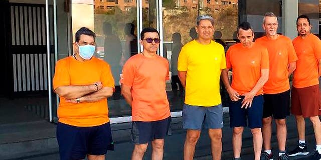 This undated file photo posted on Twitter on June 18, 2020, by Venezuela's Foreign Minister Jorge Arreaza, shows CITGO oil executives standing outside the Bolivarian National Intelligence Service, in Caracas, Venezuela. (Associated Press)