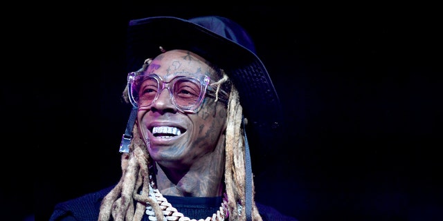 Rapper Lil Wayne - real name Dwayne Michael Carter Jr - was facing a weapons charge. 