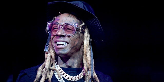 Rapper Lil Wayne - real name Dwayne Michael Carter Jr. - is facing a gun charge. 