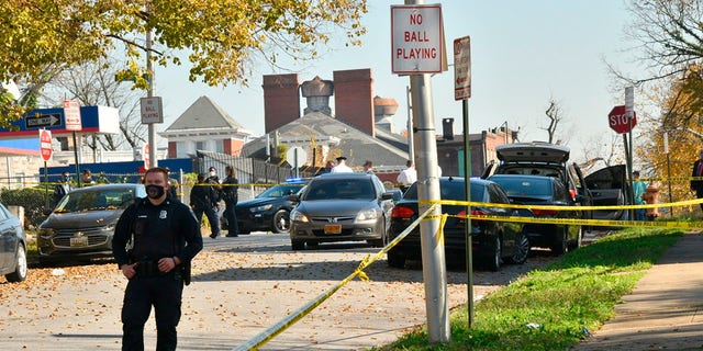 Baltimore police investigate the scene of a shooting in the city's Rosemont neighborhood. 