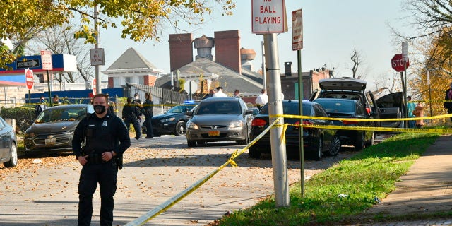 Baltimore police investigate the scene of a shooting in the city's Rosemont neighborhood. 