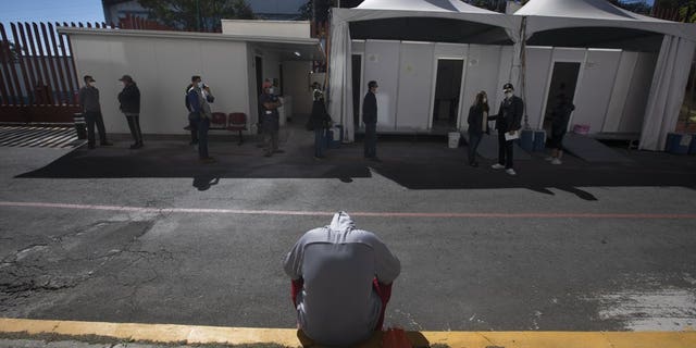 <br>
A young man waits to be tested for COVID-19 outside the Ajusco Medio General Hospital in Mexico City, Thursday, Nov. 19, 2020. (AP Photo/Marco Ugarte)