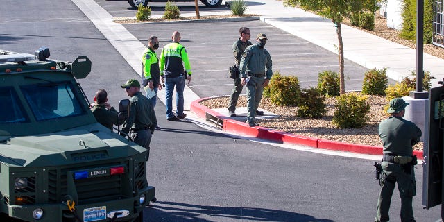 Henderson Police officers are shown at the scene of a fatal shooting in an apartment complex in Henderson, Nevada. (Steve Marcus/Las Vegas Sun via AP)