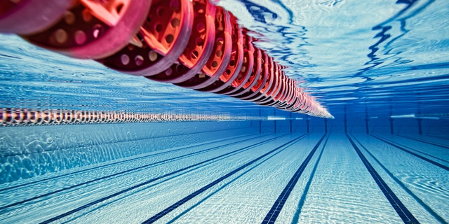 Olympic Swimming pool underwater background.