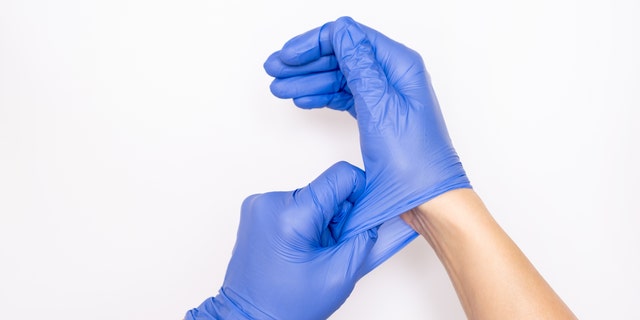 The world's largest manufacturer of surgical gloves is temporarily shutting down more than half of its factories despite record demand - as more than 1,000 employees have tested positive for the coronavirus, authorities said on Monday.  (iStock)