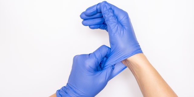 The world's largest manufacturer of surgical gloves is temporarily shutting down more than half of its factories despite record demand - as more than 1,000 employees have tested positive for the coronavirus, authorities said on Monday.  (iStock)