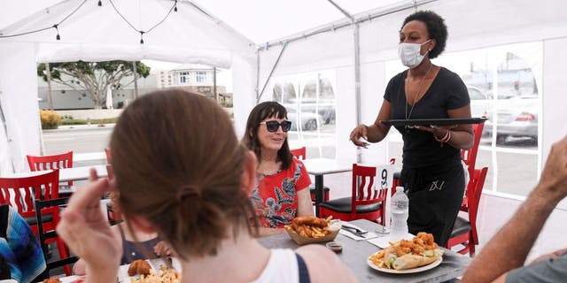 For diners who choose to eat out, the CDC recommends wearing masks as much as possible, socially distancing themselves, and washing their hands when entering and leaving the restaurant.