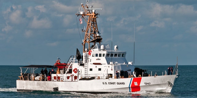 A U.S. Coast Guard vessel sail off the coast of Key West.