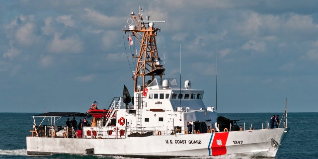 A U.S. Coast Guard vessel sail off the coast of Key West.