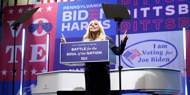 Lady Gaga speaks before performing during a drive-in rally for Democratic presidential candidate former Vice President Joe Biden at Heinz Field, Monday, Nov. 2, 2020, in Pittsburgh, Pa.
