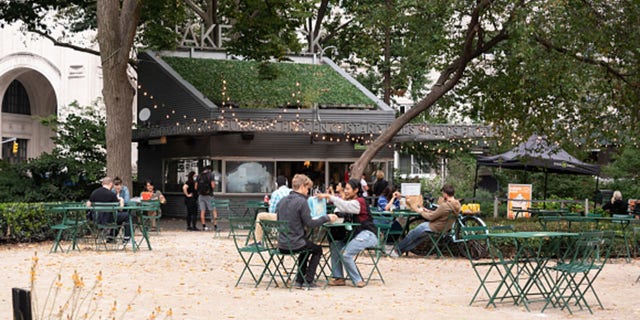 File photo - people dine outside Shake Shack in Madison Square Park in September. (Photo by Noam Galai/Getty Images)
