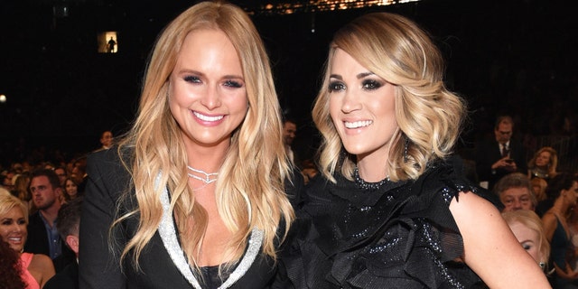 Recording artists Miranda Lambert, left, and Carrie Underwood are shortlisted for Artist of the Year at the 2020 CMA Awards (Photo by Kevin Mazur / ACMA2017 / Getty Images for ACM)