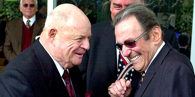 FILE - On April 1, 2002, profile photo, comedians Don Rickles, left and Norm Crosby attended a ceremony honoring comedian Milton Berle at Hillside Memorial Park and The Morgue in Los Angeles. Crosby, the English-speaking comedian who thrived in the 1960s, 70s, and 80s as a TV comedian, nightclub and casino, passed away. He is 93 years old. Crosby's daughter-in-law, Maggie Crosby, told the New York Times that the comic died on Saturday, November 7, 2020 from heart failure in Los Angeles. (Photo AP / Nick Ut, File)