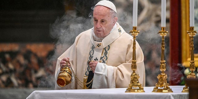 Pope Francis incenses the altar as he celebrates mass on the feast of Christ the King on Sunday in St. Peter's Basilica in the Vatican.  (Vincenzo Pinto / Pool Photo via AP, File)