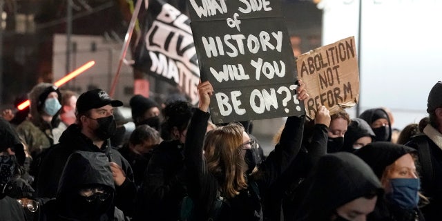 People march on the night of the election in Seattle, Tuesday, Nov. 3, 2020. (AP Photo/Ted S. Warren)