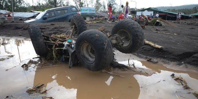 An All-Terrain Vehicle is toppled by strong winds and floods from Typhoon Goni as it hits Daraga, Albay province, central Philippines, Sunday, Nov. 1, 2020. AP Photo
