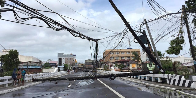 Electrical poles are toppled due to strong winds from Typhoon Goni in Daet, Camarines Norte province, central Philippines, Sunday Nov. 1, 2020.