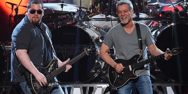 LAS VEGAS, NV - MAY 17: Bassist Wolfgang Van Halen (L) and guitarist Eddie Van Halen of Van Halen perform during the 2015 Billboard Music Awards at MGM Grand Garden Arena on May 17, 2015 in Las Vegas, Nevada.