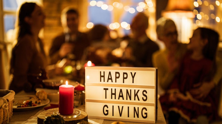 Happy Thanksgiving sign with people